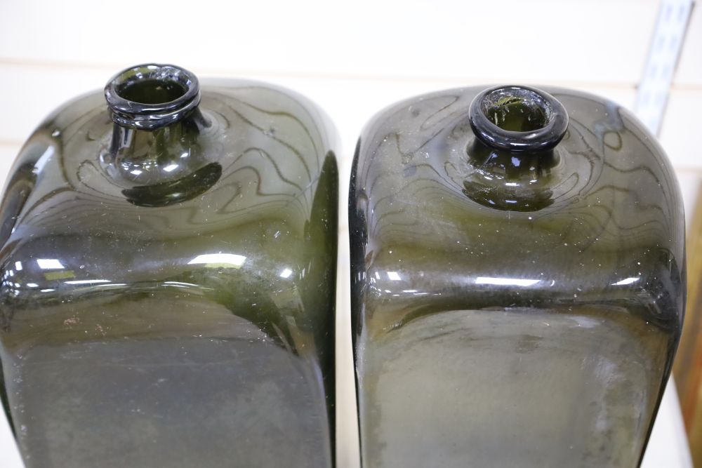 Two green glass carboys